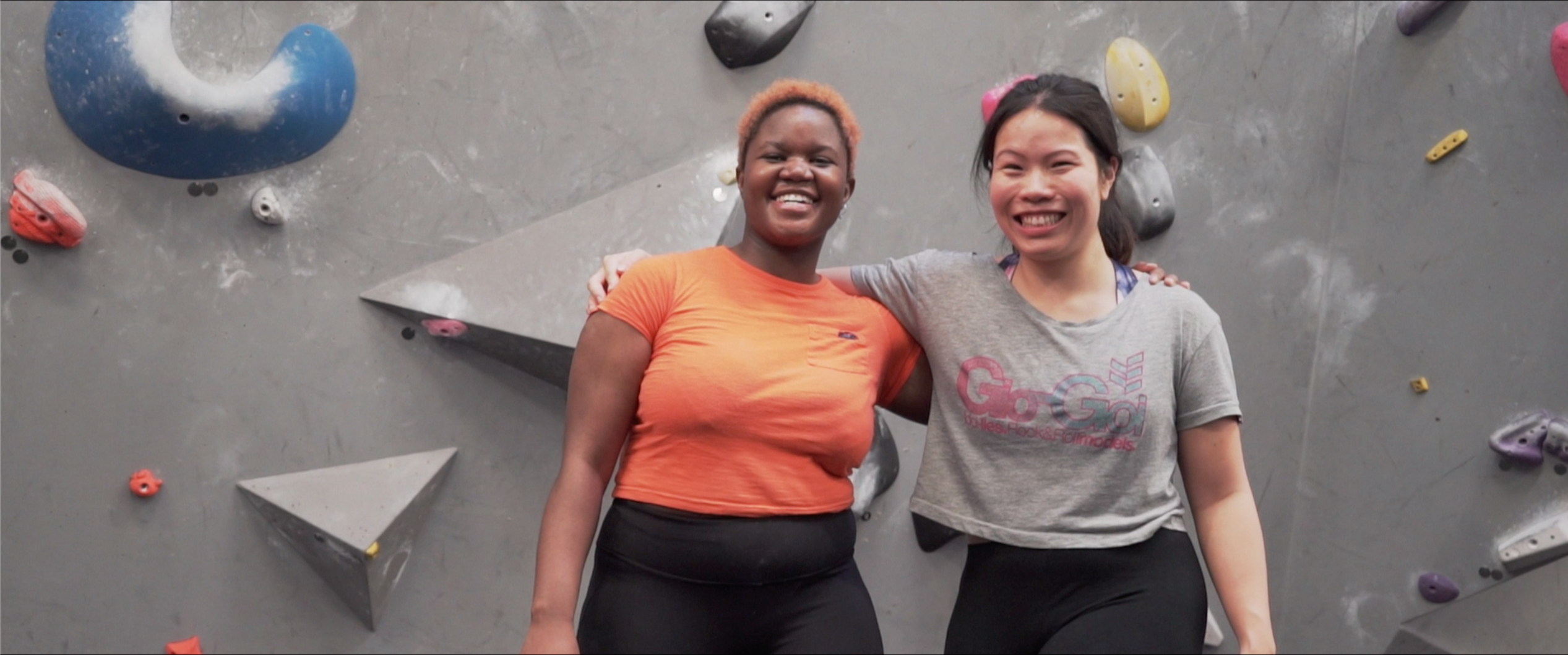 Two women with their arms around eachother at The Climbing Hangar