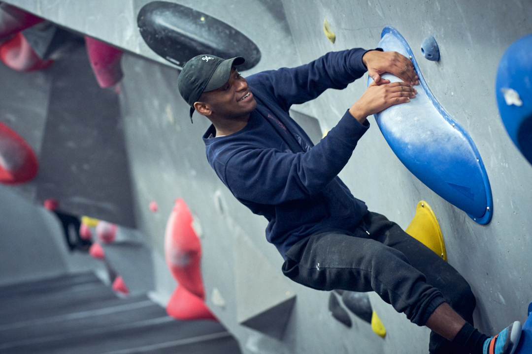 A man on a climbing wall