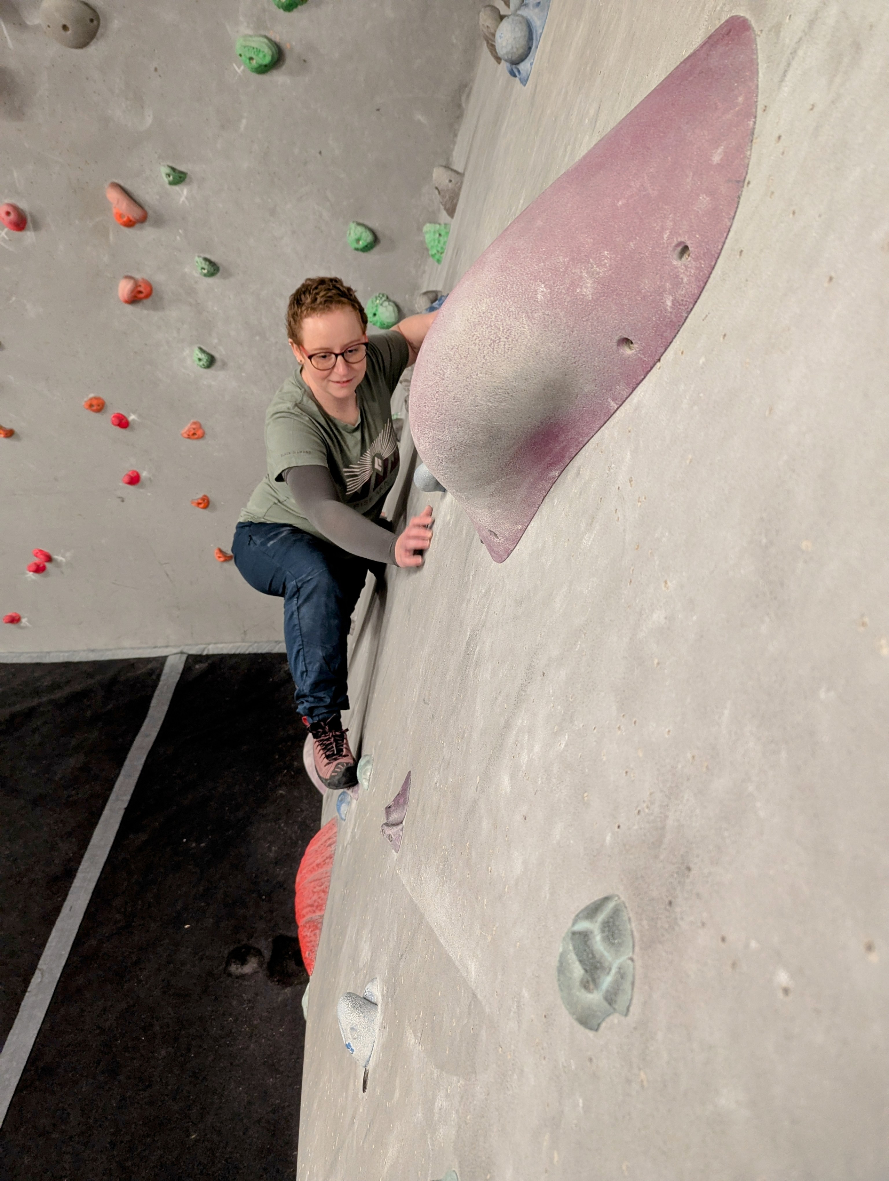 A female climber on a climbing wall